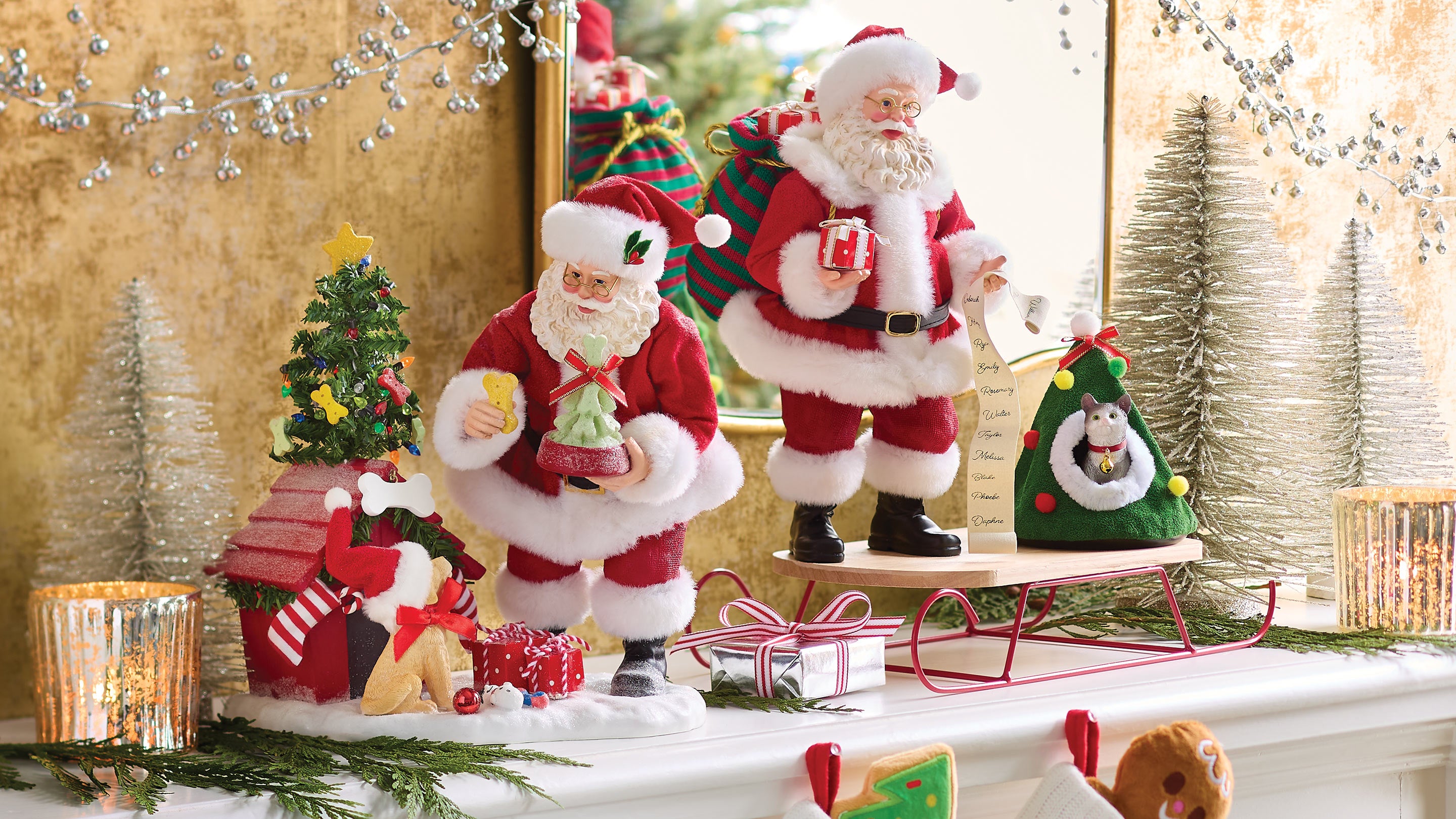 Decorative Santa Claus figures on a mantelpiece with Christmas decorations.